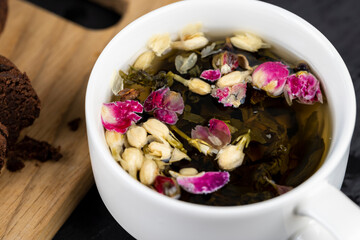 green tea with rose and jasmine flowers
