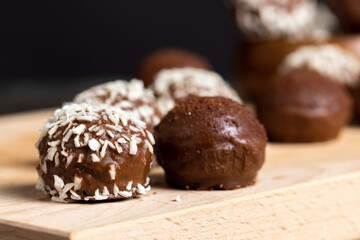 Chocolate candies with coconut flavor and filling