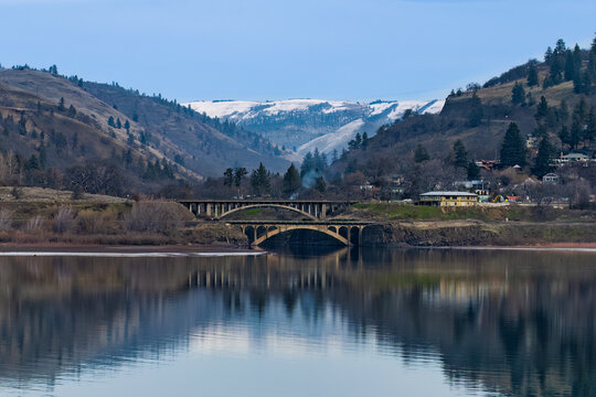 Twin bridges, reflecting on Columbia River.