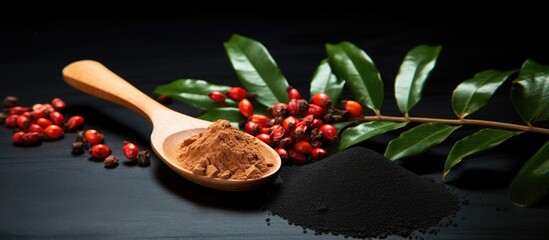 Natural tonic made from guarana powder in a wooden spoon used in alternative medicine supplements and sports nutrition