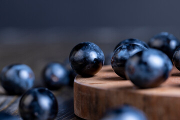 Unwashed blue grapes in the dust