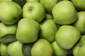 Fresh green apples as background, top view