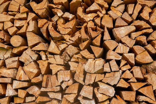 Closeup of stacked firewood used for heating homes 
