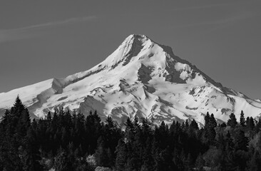 Mt. Hood covered in snow, black and white.
