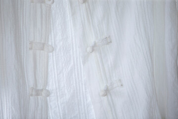 Fototapeta na wymiar White shirt hanging on a clothes hanger, shallow depth of field