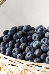 Fresh juicy blueberries in the basket. Wild berries.