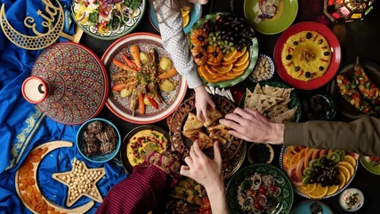 Fotobehang Eid holiday table. Ramadan family dinner. Breaking Fast, iftar. Arabic Middle Eastern traditional cuisine © Fevziie