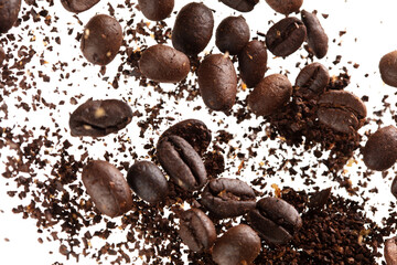 Coffee bean powder fly explosion, Coffee crushed ground float pouring, wave like smoke smell. Coffee bean powder splash throwing in mid Air. White background Isolated selective focus blur