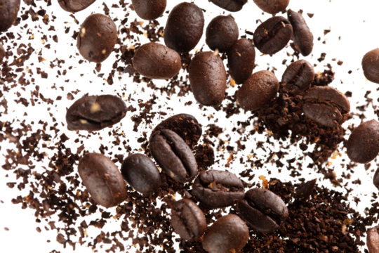 Coffee bean powder fly explosion, Coffee crushed ground float pouring, wave like smoke smell. Coffee bean powder splash throwing in mid Air. White background Isolated selective focus blur