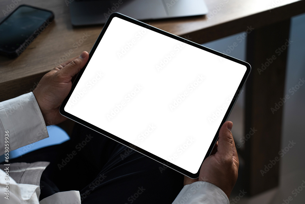 Poster digital tablet computer close up man using tablet hands man multitasking with isolated screen