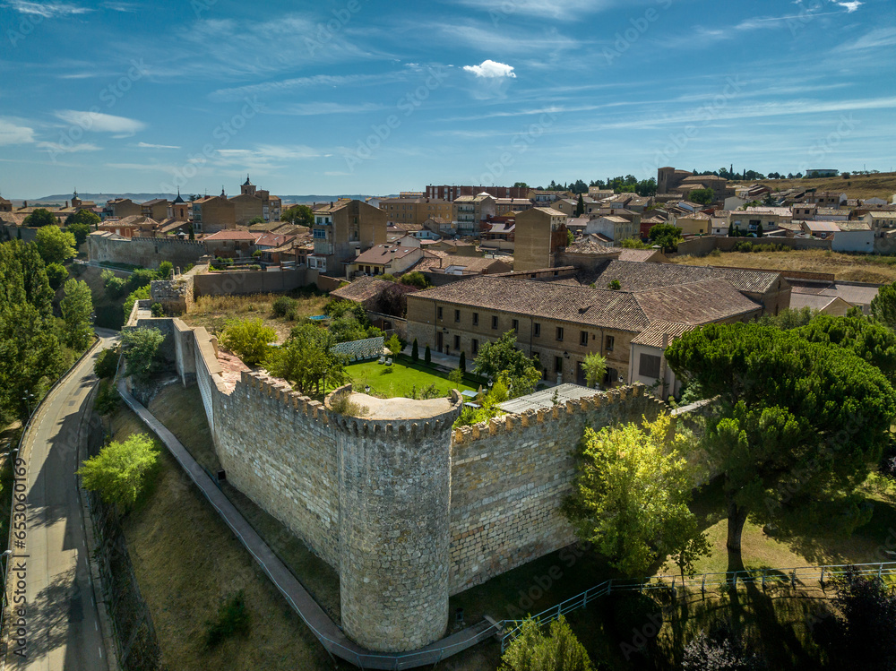 Wall mural aerial view of almazan city walls, fortified gate, battlements above the ebro river in spain with cl