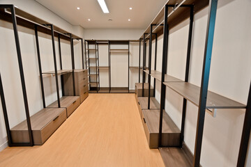 The dressing room, which is fully decorated with system cabinets, is spacious and provides high space utilization