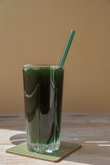 Organic blue-green algae spirulina detox drink in glass powder food. Health protein cocktail smoothie of chlorella. Vitamins and minerals to diet. Prebiotic and antioxidant rich Dietary supplement
