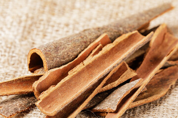 Close up of healthy Cinnamon Bark isolated on burlap background