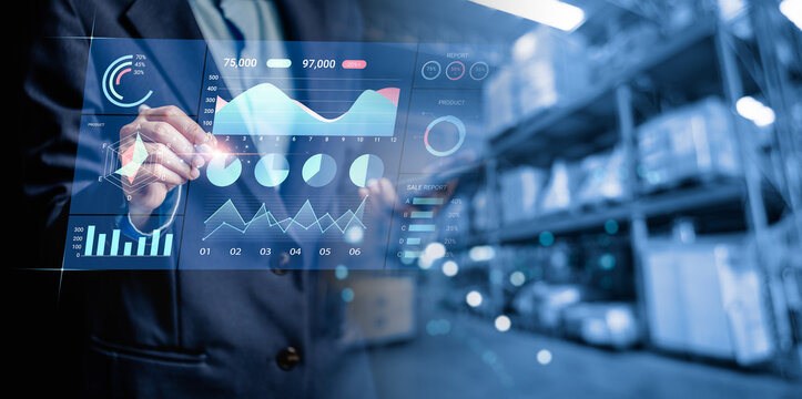 Businesswomen analyzes to chart data business on a visual screen dashboard, technology devices and screens visible in the background, financial planning, market research, and the stock market. - Powered by Adobe