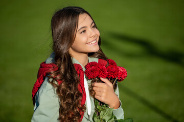 happy teen girl with fall bouquet outside. photo of teen girl with fall bouquet