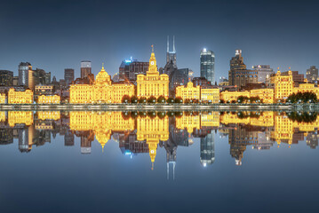 Illuminated Shanghai Skyline Reflecting On River