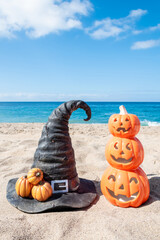 Halloween ocean background with witch hat and pumpkins