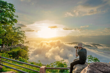 Tourists are taking pictures of beautiful views at Pha Mo I Daeng National Park in the morning.