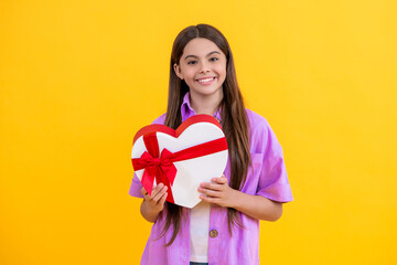 teen girl has Valentines mood. teen girl hold gift on Valentines Day. teen girl holding box of...