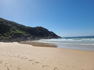 Fototapeta na wymiar Rocks and cliff on the sandy Boomerang Beach New South Wales Mid-North Coast Australia
