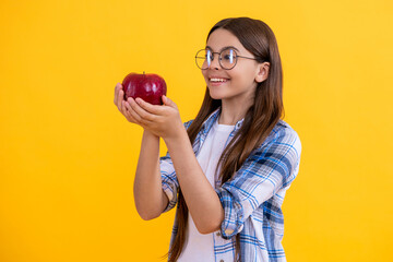 natural vitamin for teen girl. teen girl eating healthy food. teen kid girl holding apple. healthy food. Fresh apple for teen girl. Healthy food and vegetarian diet. childhood health. Healthy snack