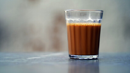 Fresh milk tea or Indian Kadak Chai on glass