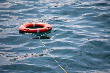 red lifebuoy on the water in the sea