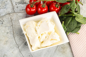 Soft cream cheese in the bowl