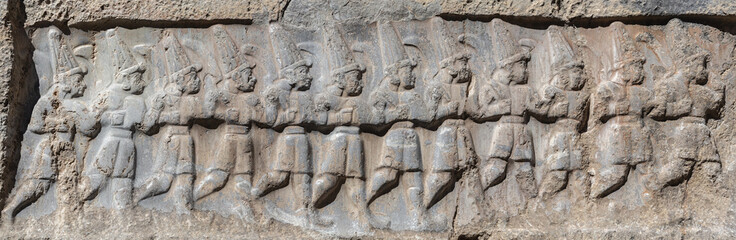 Fototapeta na wymiar Rock relief, depicting the twelve Hittite gods of the Underworld in Yazilikaya, a sanctuary of Hattusa. Near Bogazkale, Corum, Turkey
