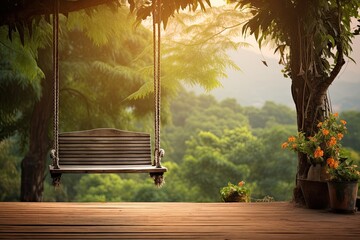 Old wooden terrace with wicker swing hang on the tree with blurry nature background