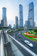 financial buildings in the Bund of Shanghai and moving bus on the highway