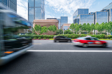 financial buildings in the Bund of Shanghai and moving bus on the highway