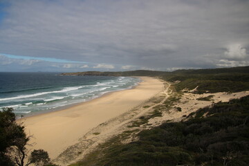 Lighthouse beach with waves crashing on the shore. Seal Rocks New South Wales Australia