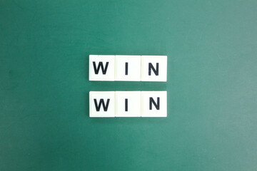 hands holding letters of the alphabet with the word win win. Compromise, perfect. Consent and...