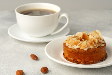 Tart pie with almond petals on plate