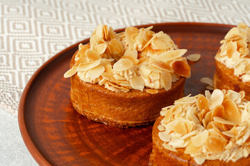 Tart pie with almond petals on plate