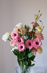 A bouquet of Eustoma flowers stands in the greenhouse.