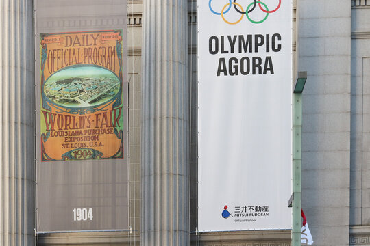 TOKYO, JAPAN - July 21, 2021: Olympic banners on the front of the historic 1929 Mitsuihonkan building in Nihonbashi. One of them is for the Olympic Agora, the other is a 1904 St Louis Games banner. 