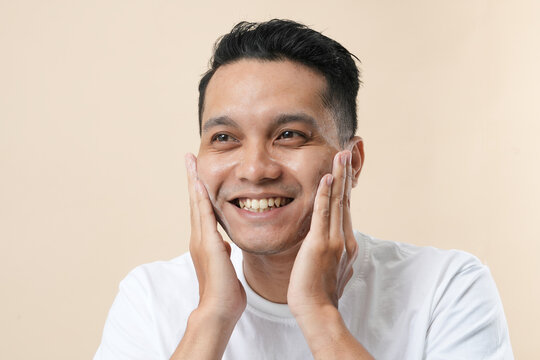 Photo of a young Asian man face healthy skin and natural skincare.