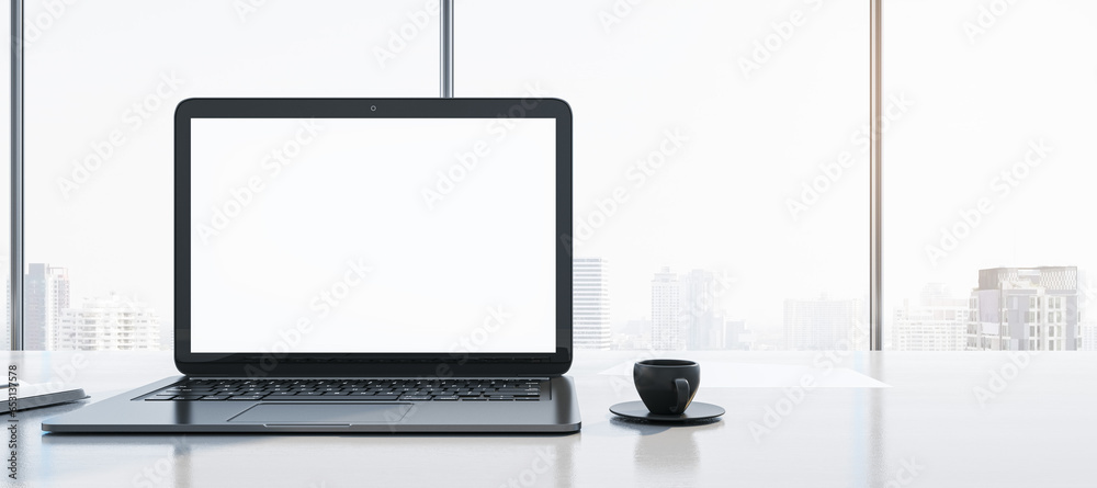 Poster close up of clean workplace with empty white mock up laptop screen, supplies, coffee cup and panoram