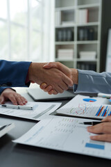Business people shaking hands together, Business partnership handshake concept.Photo two coworkers handshaking process.Successful deal after great meeting