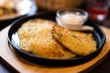 Potato pancakes with sour cream closeup. Belorussian cuisine