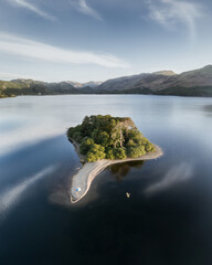 kayaker and tent camping adventure on derwentwater lake, lake district, uk