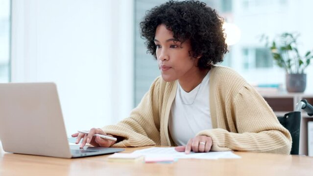 Laptop, writing and a business woman in a wheelchair in an office for work on a company report. Computer, learning or research and a young employee with a disability for development in the workplace