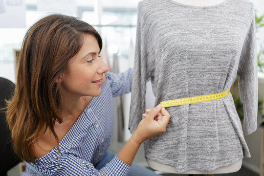 Beautiful Young Woman In Measuring Dummy With Tape