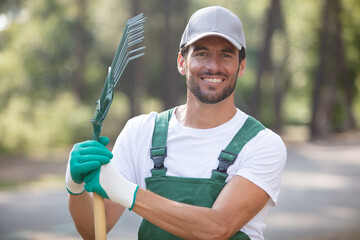 portrait of working man with a gardening rake