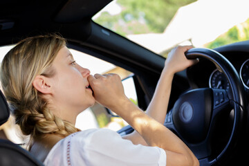 a stressed young woman driver