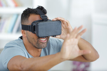 portrait of young man with 3d virtual reality glasses