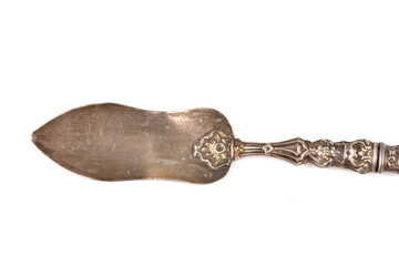 vintage silver spoon used for praline and sugar isolated on white background
